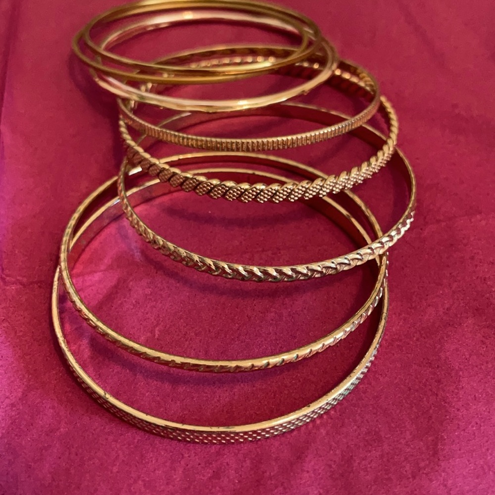 SET OF 9 GOLD TONE BRACELETS